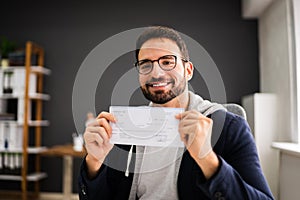 Holding Paycheck Or Payroll Check Or Insurance Cheque photo