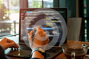 Holding the pen pointing or Program developers using