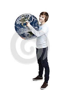 Holding and pointing to a planet earth