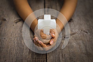 Holding a Religious Cross