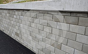 Holding a road notch of a bridge forecourt tunnel. retaining wall with concrete grouting is covered with fake, optically prettier photo