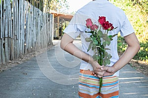 Holding a rose, surprise on Valentine`s Day