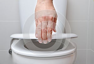 Holding the toilet bowl