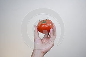 Holding tomato, vegetable, fruit, healthy skin, Asian skin tone photo