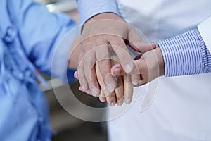 Holding Touching hands Asian senior or elderly old lady woman patient with love, care, helping, encourage and empathy