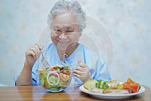 Holding Touching hands Asian senior or elderly old lady woman patient with love, care, helping, encourage and empathy at nursing