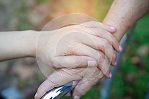 Holding Touching hands Asian senior or elderly old lady woman patient with love, care, helping, encourage and empathy at nursing h