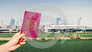 Holding a UK passport with generic airplane taxiing