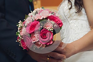 Holding wedding flowers close up