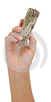 Holding a white sage smudge stick in right hand