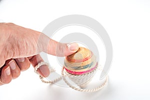 Holding a Wooden Pegtop