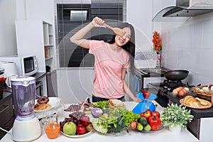 Holding wooden spatula turner in kitchen room