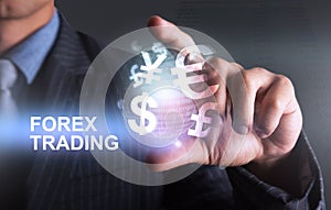 Holding world of currency forex trading with 2 finger