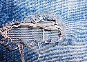 The hole on the blue jeans