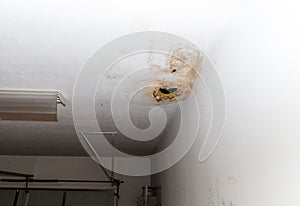 Hole in ceiling from water damage