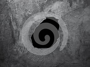 Hole on cement wall background