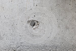 Hole on cement wall background