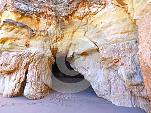 View of a cave through a opening in a Algarve cave in Portimao Portugal at praia da rocha