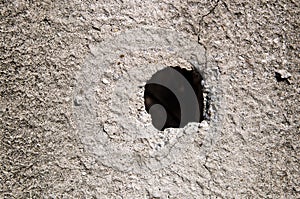 Hole in concrete wall