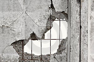 White isolated background through hole in a concrete wall