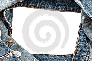 Hole in denim on a white background. Ripped jeans