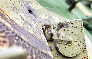 Hole or hole, armor deformation from a projectile close-up. Damaged armor of a Russian armored personnel carrier by shell