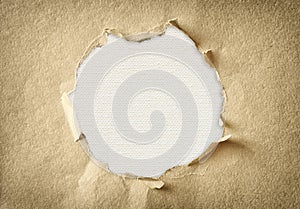 Hole made of torn paper over textured canvas background