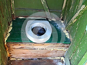 Hole of the old dirty country toilet, rural toilet inside