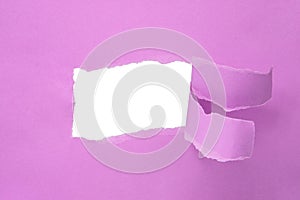 Hole in paper pink background torn damaged for design