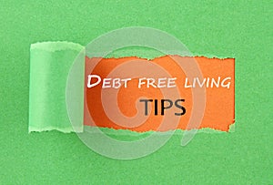 Hole in the paper with the text Debt free living