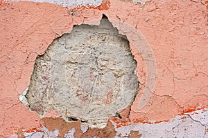 Hole in the place of the disappeared layer of plaster