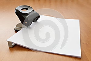 Hole puncher with paper