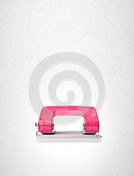 Hole puncher or paper hole puncher on background.