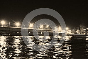 The Hole River Ganga - Ganges - at a Bathing Ghat in Haridwar at Night with Reflections of Light in Water - Uttarakhand, India