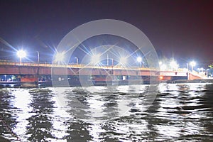 The Hole River Ganga - Ganges - at a Bathing Ghat in Haridwar at Night - Reflections of Lights in Water - Uttarakhand, India