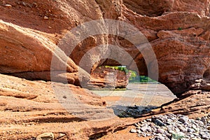 Hole In Sandstone Cliff