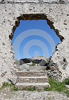 Hole in the wall of an ancient Spanish ruin