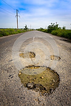 Holes on asphalt road