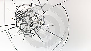 Holes from balls in glass on a white background