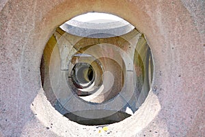 Holes through preformed concrete defence blocks