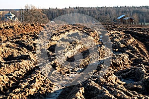 Holes and puddles on bad broken road