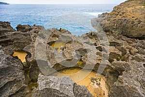 Holes in rocks of Angel`s Billabong in Nusa Penida Island, Bali, Indonesia