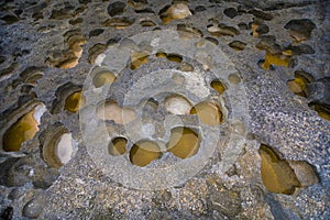 Holes in rocks of Angel`s Billabong in Nusa Penida Island, Bali, Indonesia