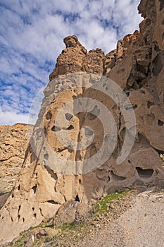 Holes in a Volcanic Tuff Cliff