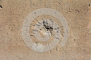 Holes on the wall from shells, bullets