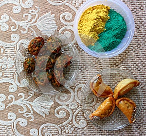 Holi celebration with food and gulal