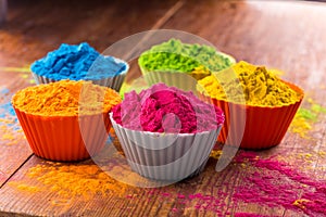 Holi color powder. Organic Gulal colours in bowl for Holi festival, Hindu tradition festive. Bright vibrant pigment