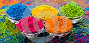 Holi color powder. Organic Gulal colours in bowl for Holi festival, Hindu tradition festive. Bright vibrant pigment closeup