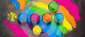 Holi colored paints. Holi traditional festival. Colorful powders in a bowl. Top view, banner