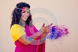 Holi Festival Of Colours. Portrait of happy indian girl in traditional hindu sari on holi color . india woman silver